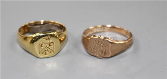 An 18ct signet ring with crest, gross 5.9 grams and a 9ct gold signet ring with monogram, 2.9 grams